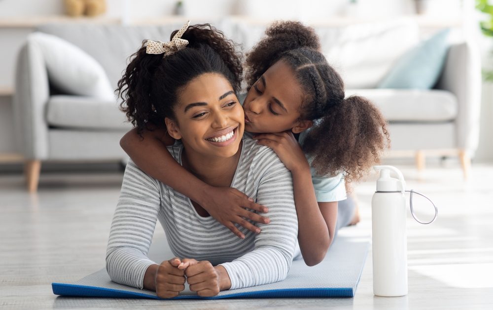 Happy,Afro-american,Mother,And,Daughter,In,Sportswear,Cuddling,While,Exercising
