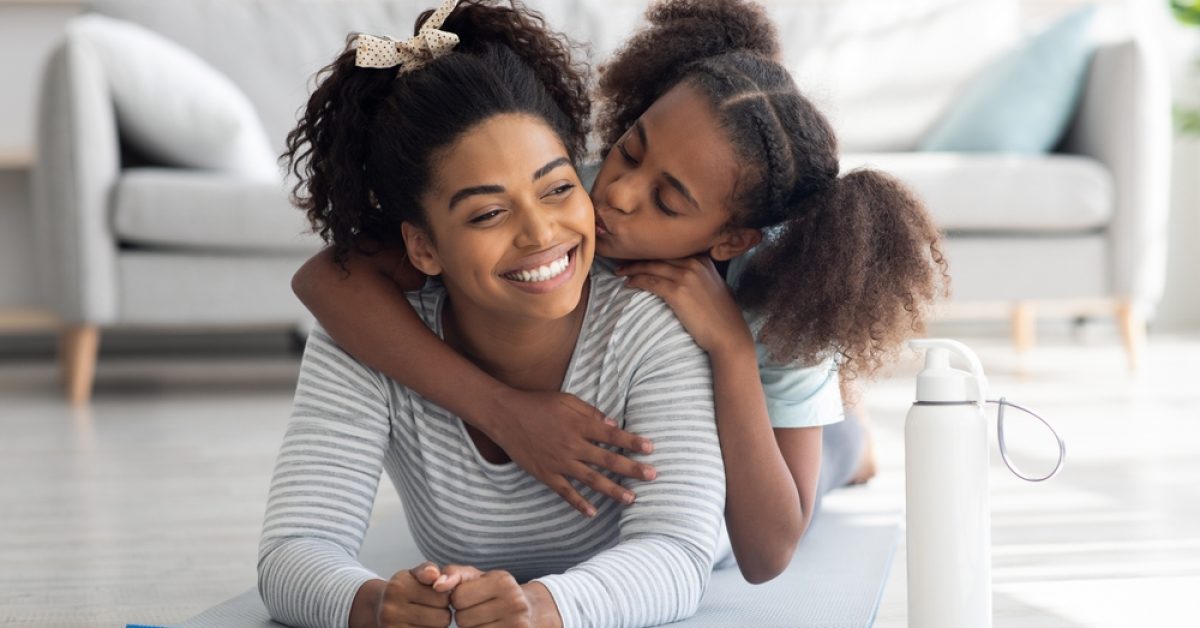 Happy,Afro-american,Mother,And,Daughter,In,Sportswear,Cuddling,While,Exercising